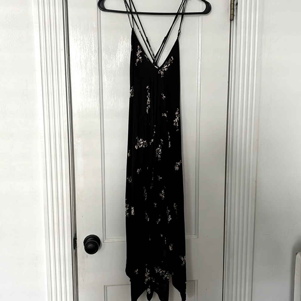 Lovestitch black dress with adjustable cross straps and asymmetrical bottom.